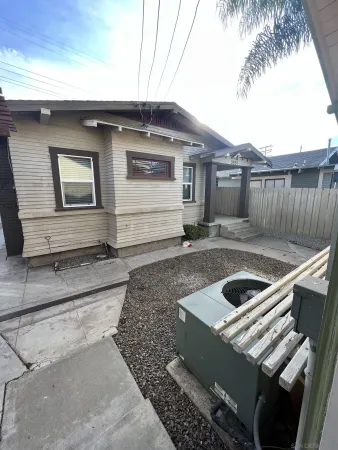 a house view with a backyard space