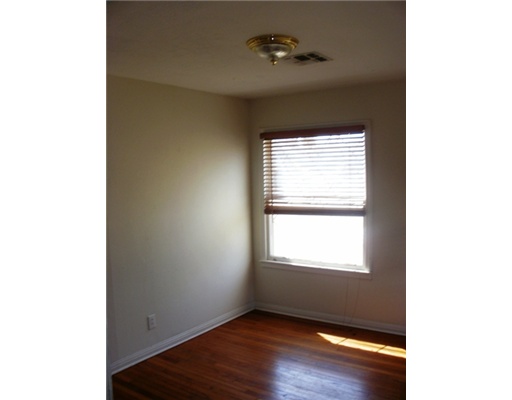 3454 Topeka Street Corpus Christi, TX 78411 - Photo 4 of 6 a view of an empty room with a window