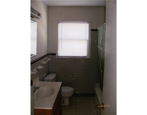 3454 Topeka Street Corpus Christi, TX 78411 - Photo 6 of 6 a bathroom with a toilet a sink and a window