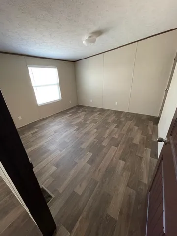 a view of an empty room with windows