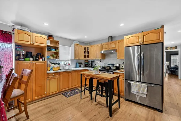 a view of kitchen with dining table and chairs