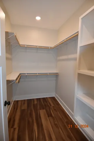 a bathroom with a double vanity sink and mirror