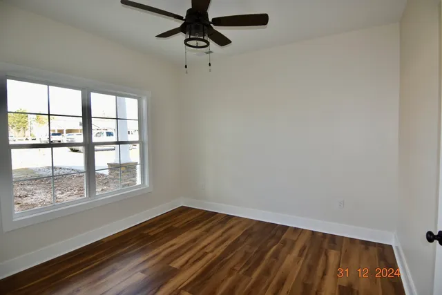a view of room with a ceiling fan