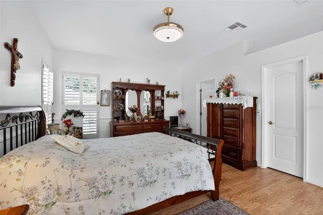 a bed room with a bed and dresser