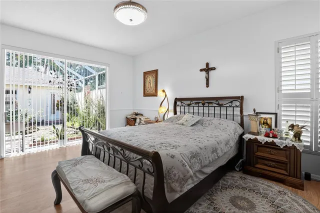 a bedroom with a bed and a couch