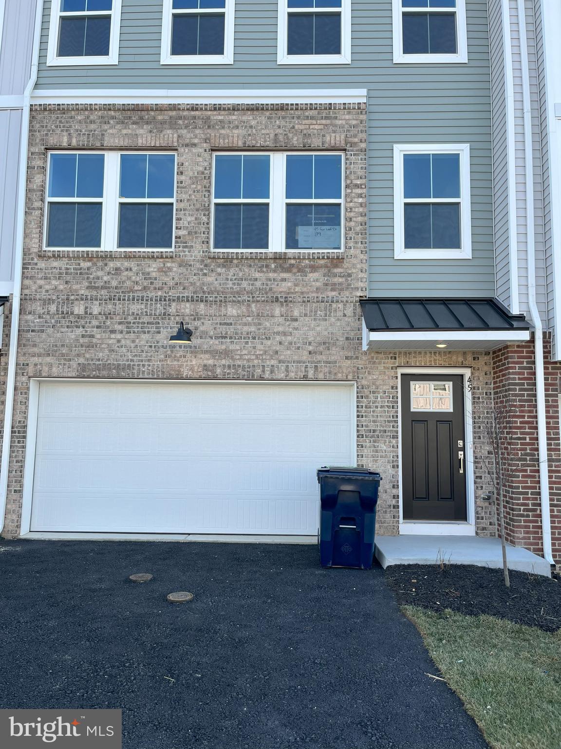 45 Four Leaf Drive Downingtown, PA 19335 - Photo 15 of 16 a front view of a house with a yard and garage