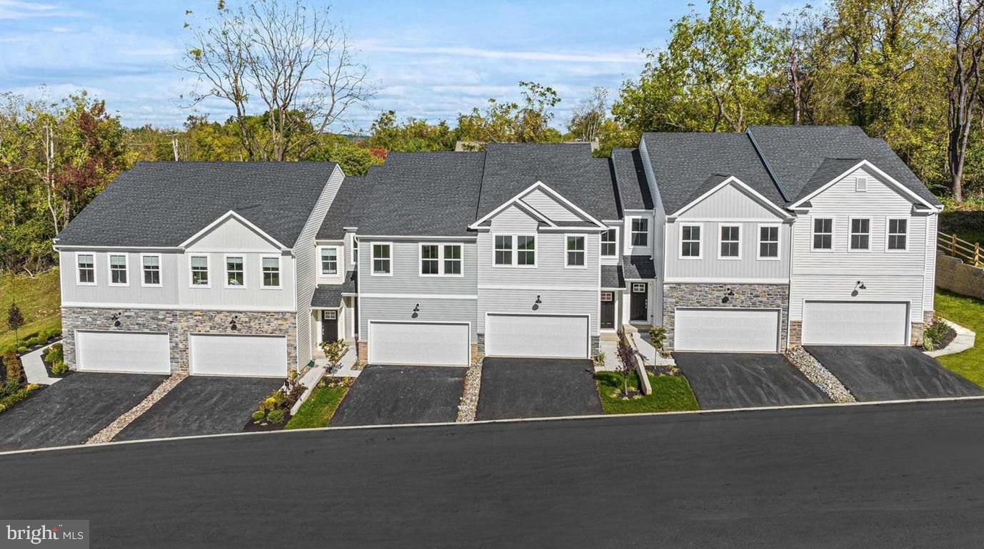 45 Four Leaf Drive Downingtown, PA 19335 - Photo 16 of 16 a view of a white house with a big yard and large trees
