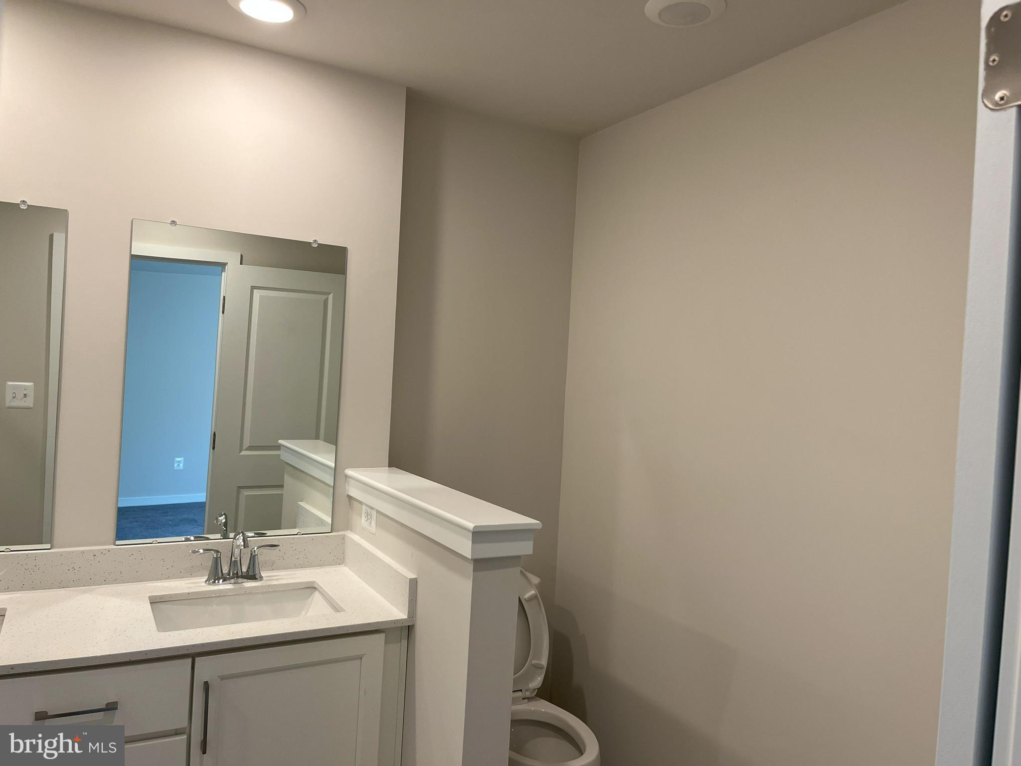 45 Four Leaf Drive Downingtown, PA 19335 - Photo 9 of 16 a bathroom with a sink vanity and a mirror