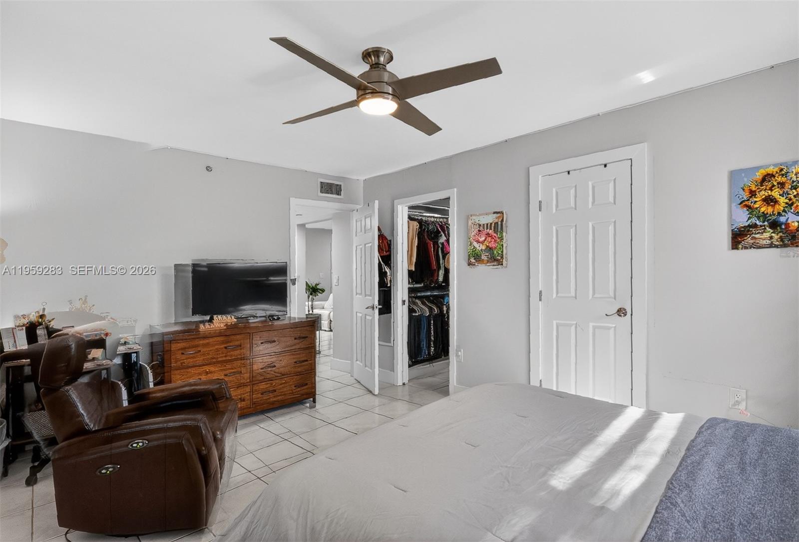 8540 Southwest 133rd Avenue Road, Unit 112 Miami, FL 33183 - Photo 14 of 23 a living room with furniture and a flat screen tv