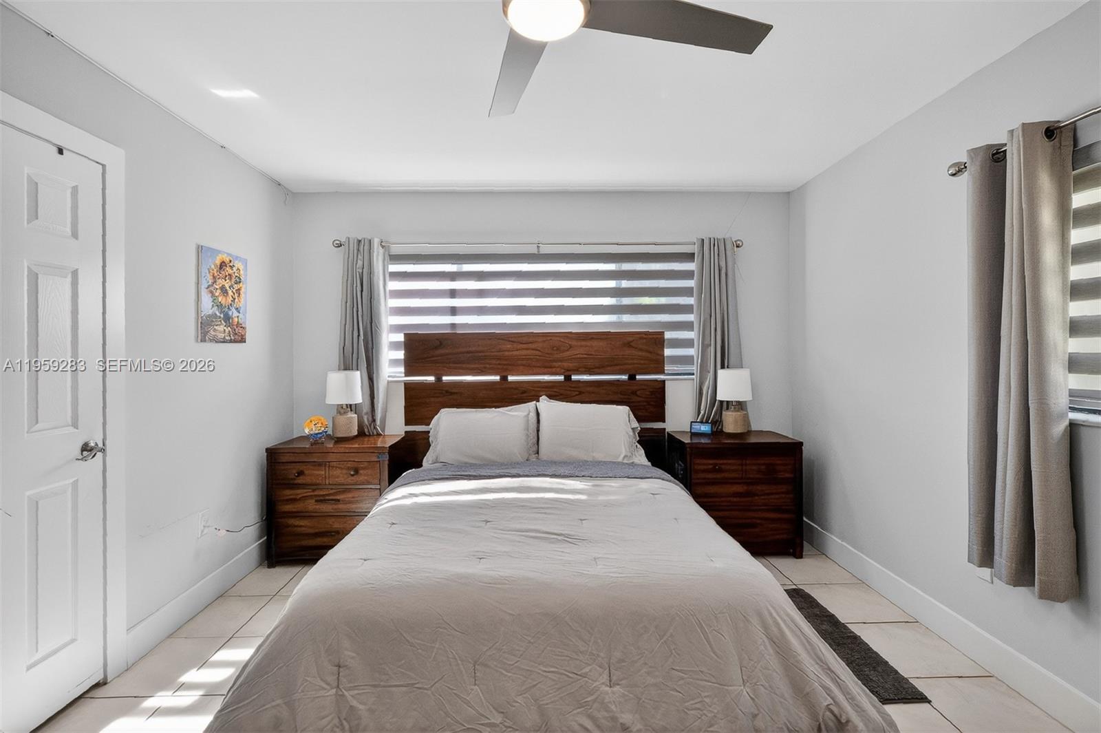 8540 Southwest 133rd Avenue Road, Unit 112 Miami, FL 33183 - Photo 15 of 23 a bedroom with a bed and a window