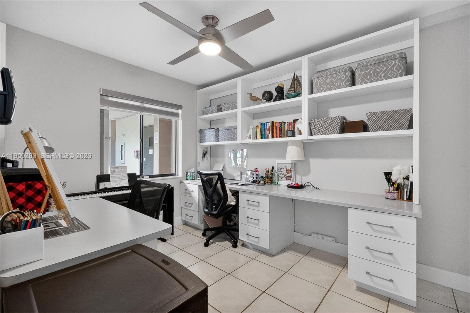 8540 Southwest 133rd Avenue Road, Unit 112 Miami, FL 33183 - Photo 20 of 23 a view of a workspace with furniture and a window