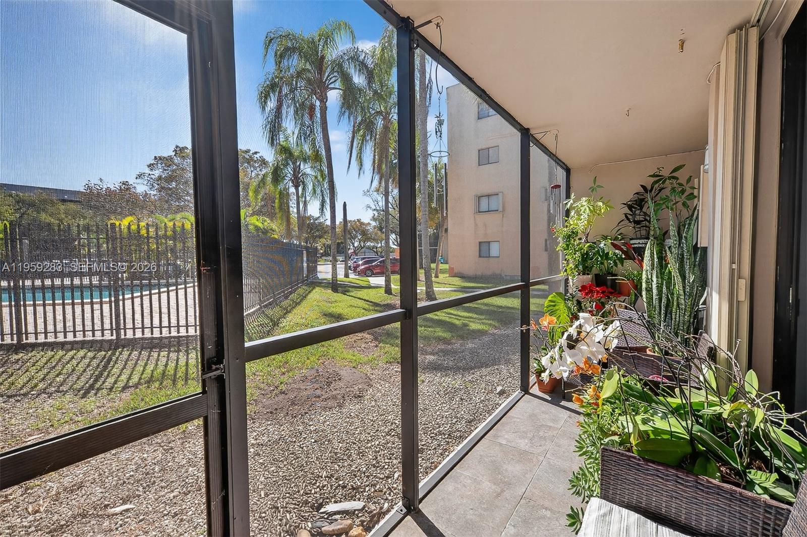8540 Southwest 133rd Avenue Road, Unit 112 Miami, FL 33183 - Photo 23 of 23 a balcony view with a garden space