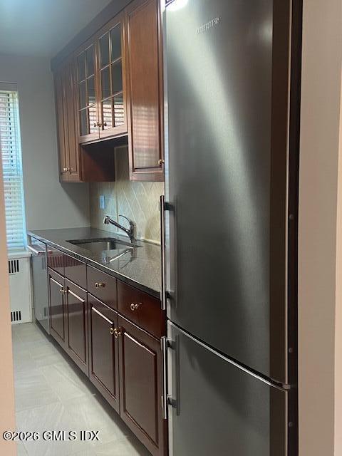 25 West Elm Street, Unit 40 Greenwich, CT 06830 - Photo 15 of 28 a kitchen with stainless steel appliances granite countertop a refrigerator and a sink