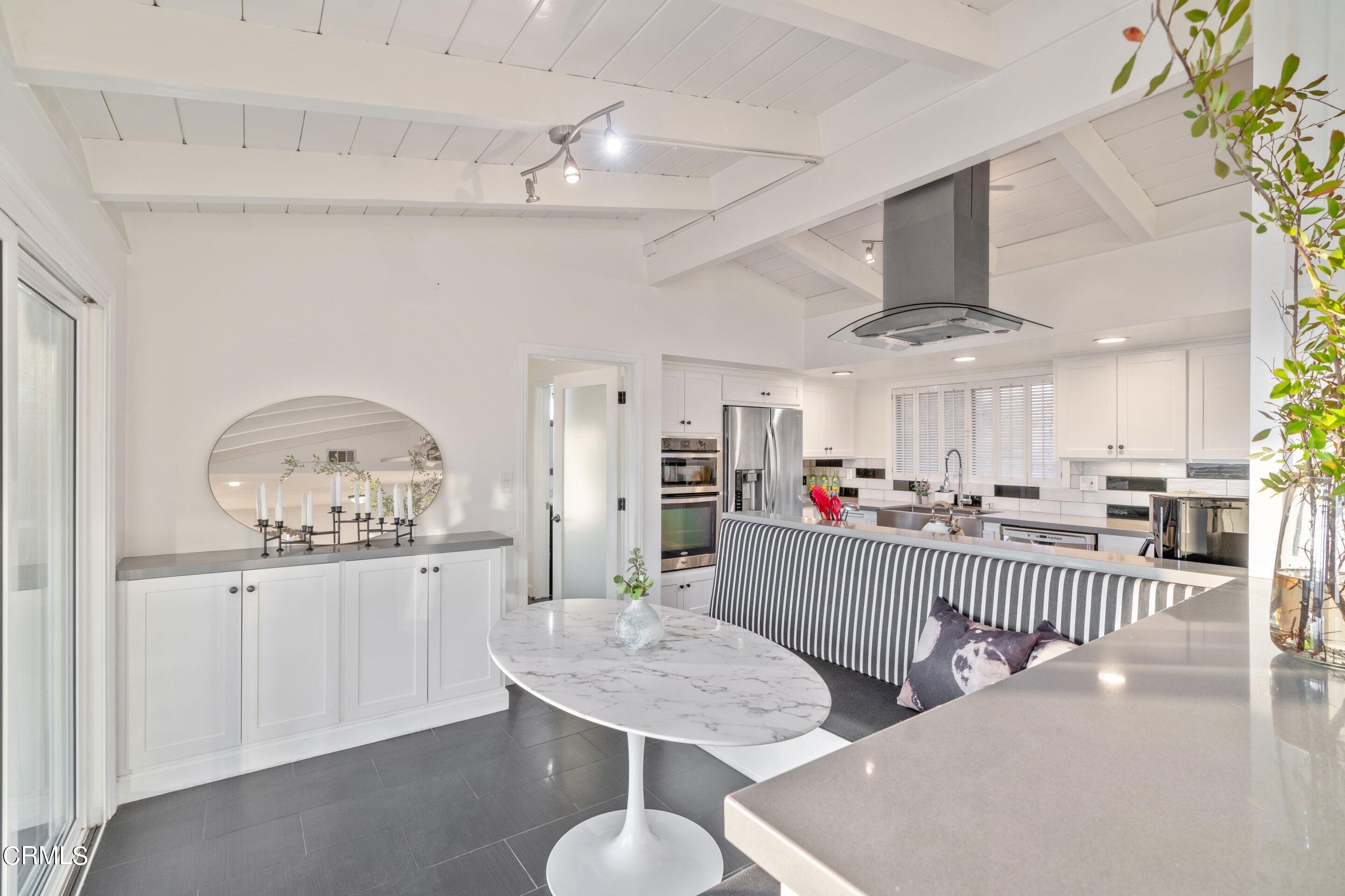 2664 Bogue Drive Glendale, CA 91208 - Photo 20 of 69 a living room with furniture and a chandelier