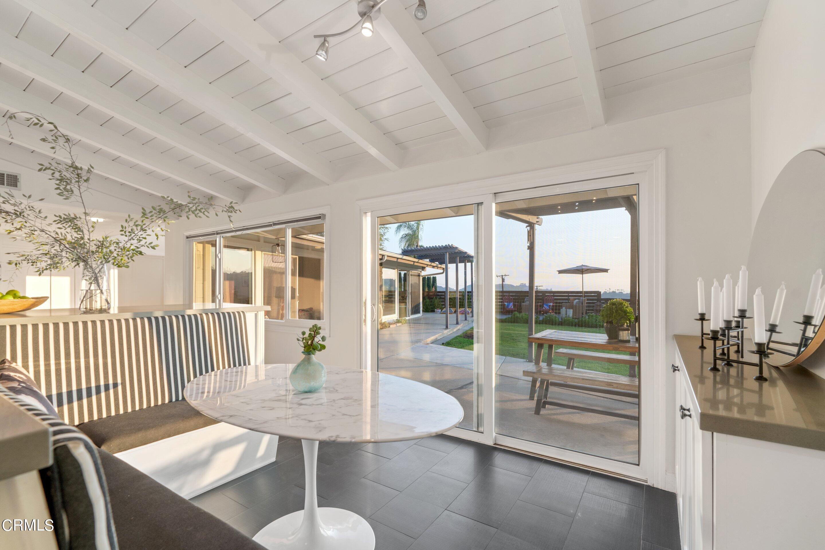 2664 Bogue Drive Glendale, CA 91208 - Photo 22 of 69 a view of a dining room with furniture wooden floor and floor to ceiling window