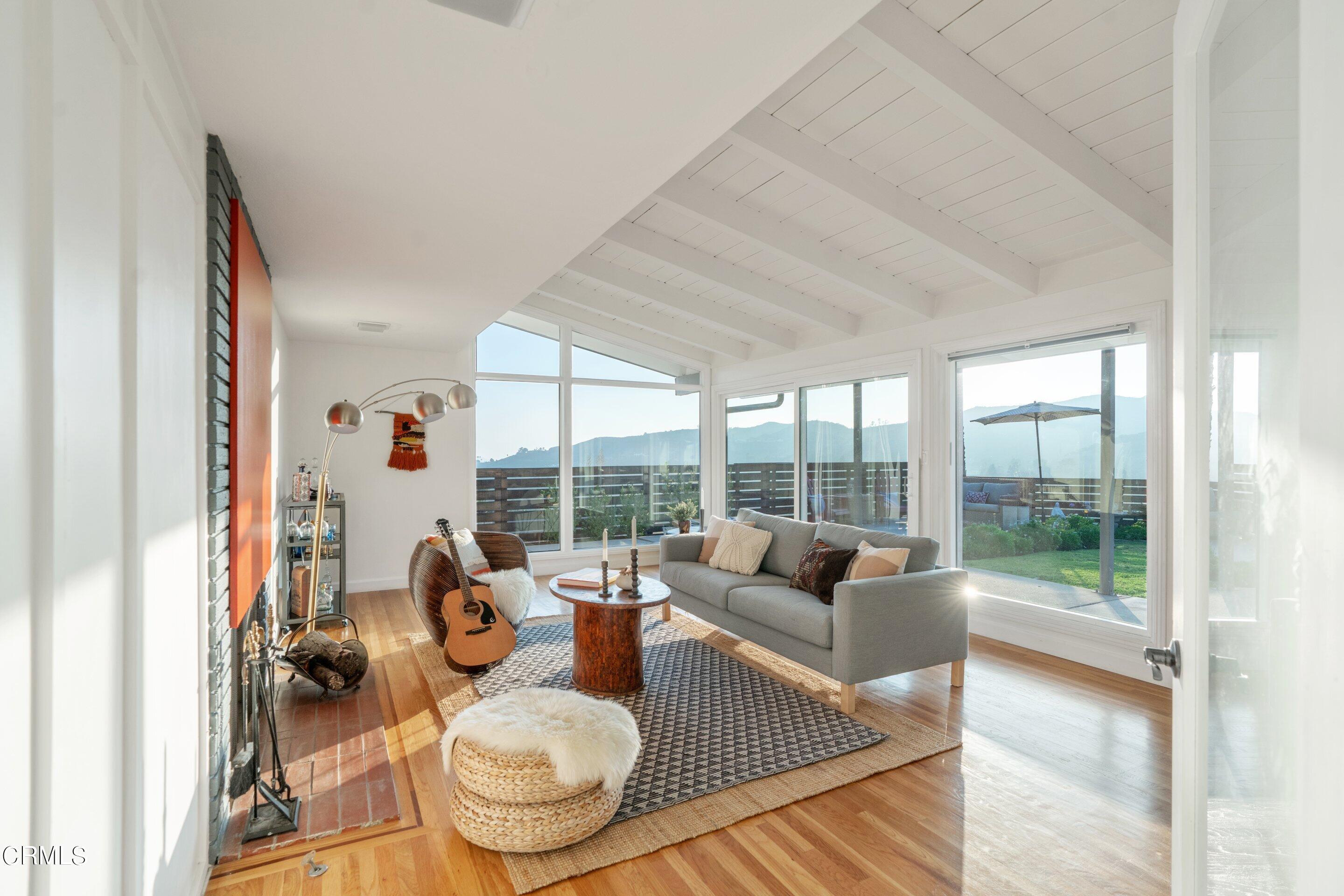 2664 Bogue Drive Glendale, CA 91208 - Photo 30 of 69 a living room with furniture and a floor to ceiling window