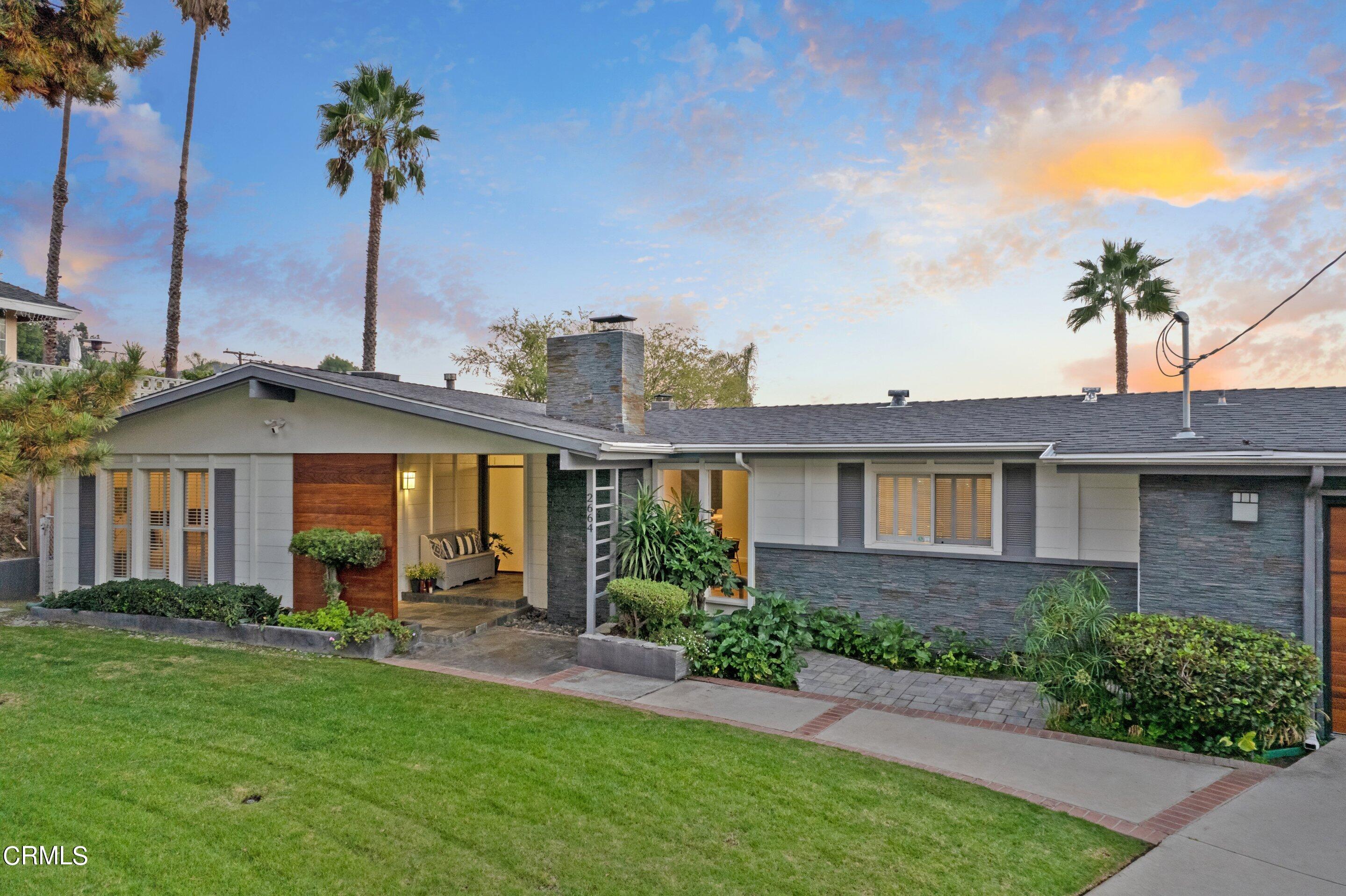 2664 Bogue Drive Glendale, CA 91208 - Photo 4 of 69 a front view of a house with a garden and plants