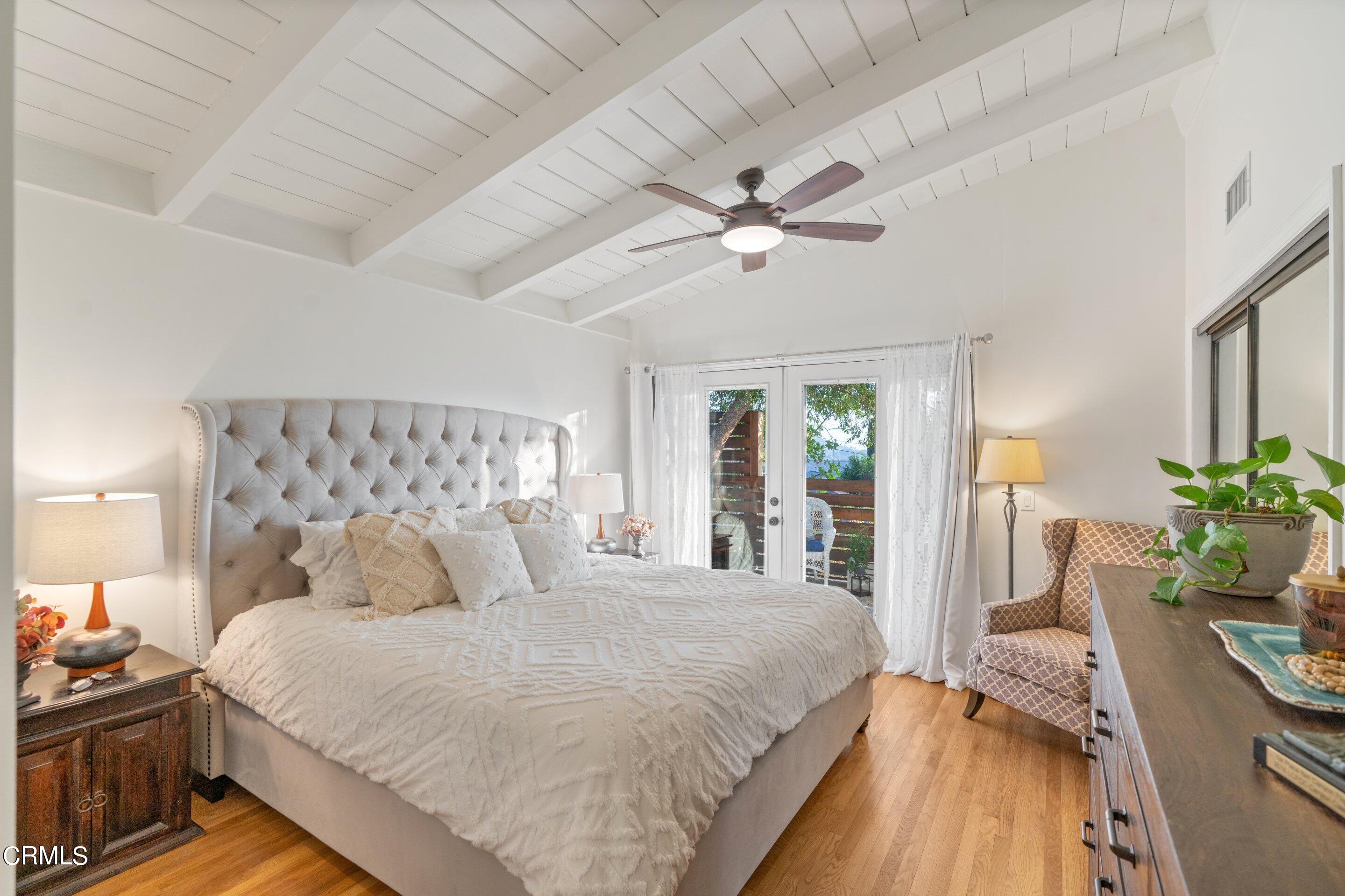 2664 Bogue Drive Glendale, CA 91208 - Photo 34 of 69 a bedroom with bed and a chandelier