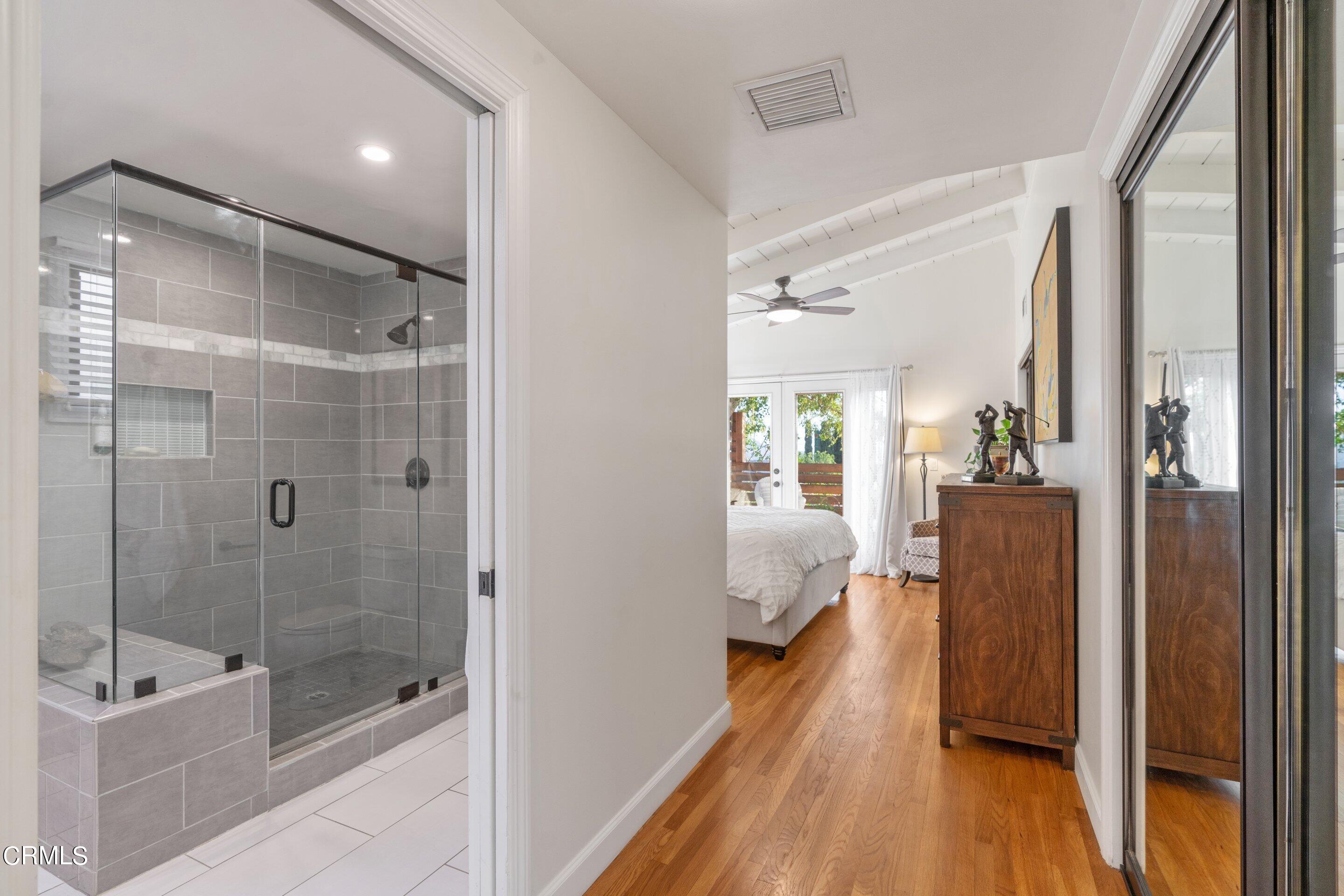 2664 Bogue Drive Glendale, CA 91208 - Photo 38 of 69 a bathroom with a glass door shower and a bathtub