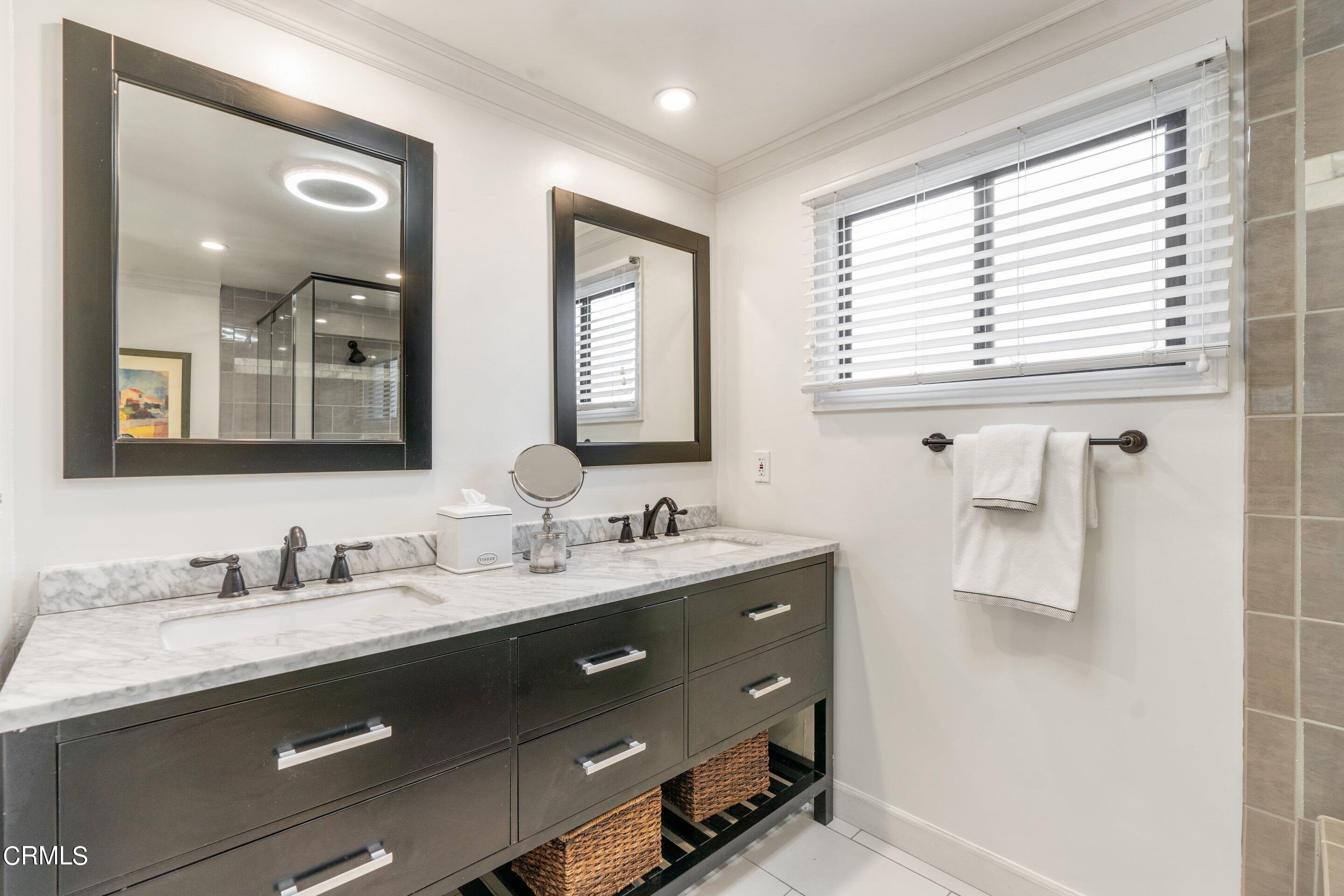 2664 Bogue Drive Glendale, CA 91208 - Photo 40 of 69 a bathroom with double sink and a mirror