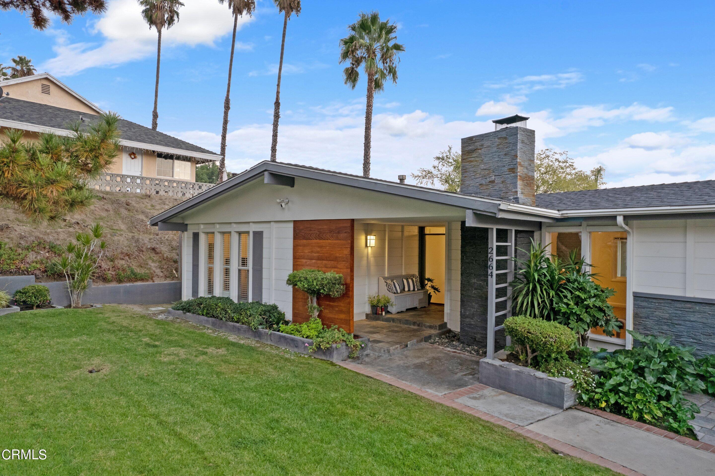 2664 Bogue Drive Glendale, CA 91208 - Photo 5 of 69 a front view of a house with a yard and potted plants