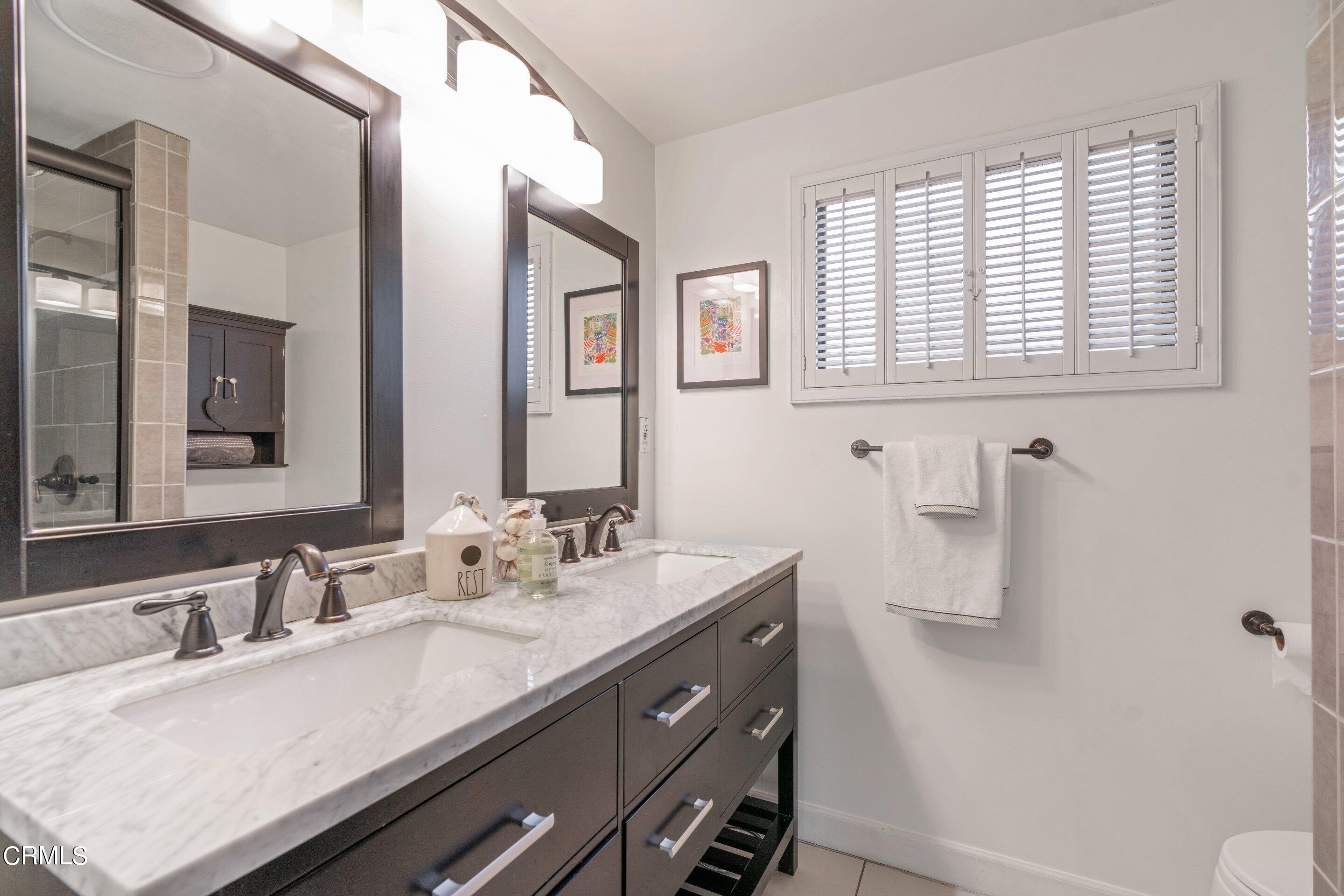 2664 Bogue Drive Glendale, CA 91208 - Photo 44 of 69 a bathroom with a sink and a mirror