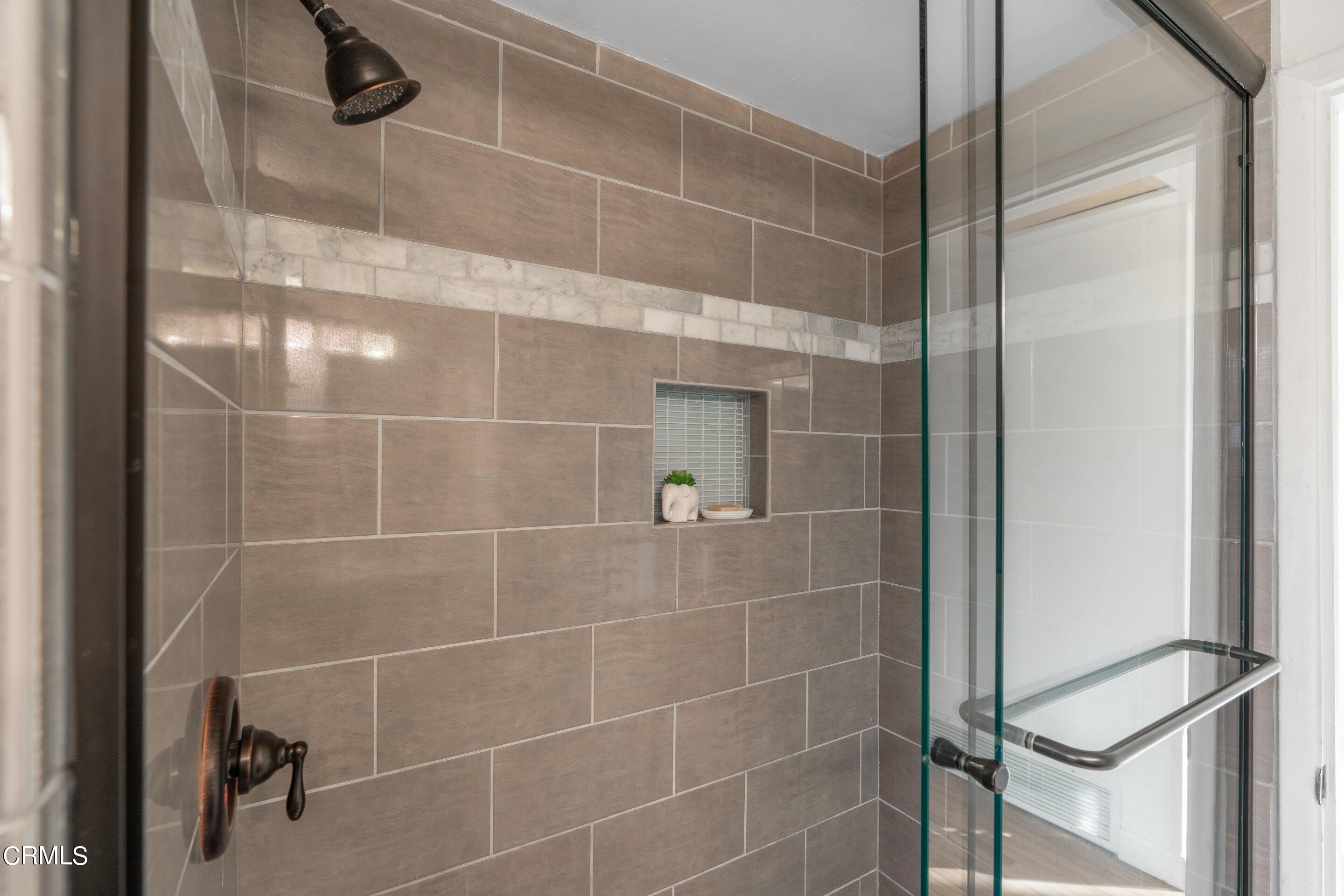 2664 Bogue Drive Glendale, CA 91208 - Photo 45 of 69 a bathroom with a glass shower door