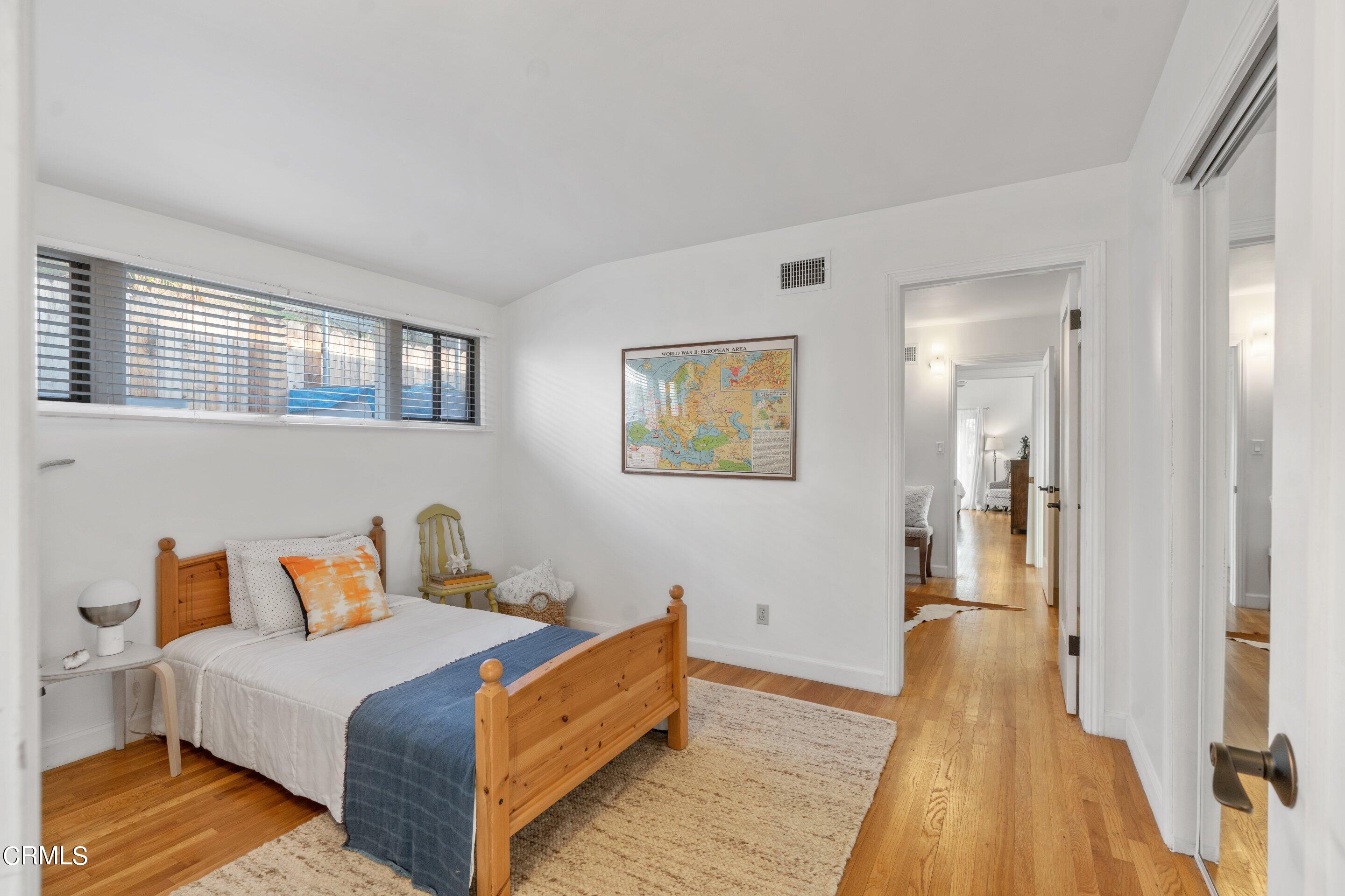 2664 Bogue Drive Glendale, CA 91208 - Photo 46 of 69 a bedroom with a bed and wooden floor