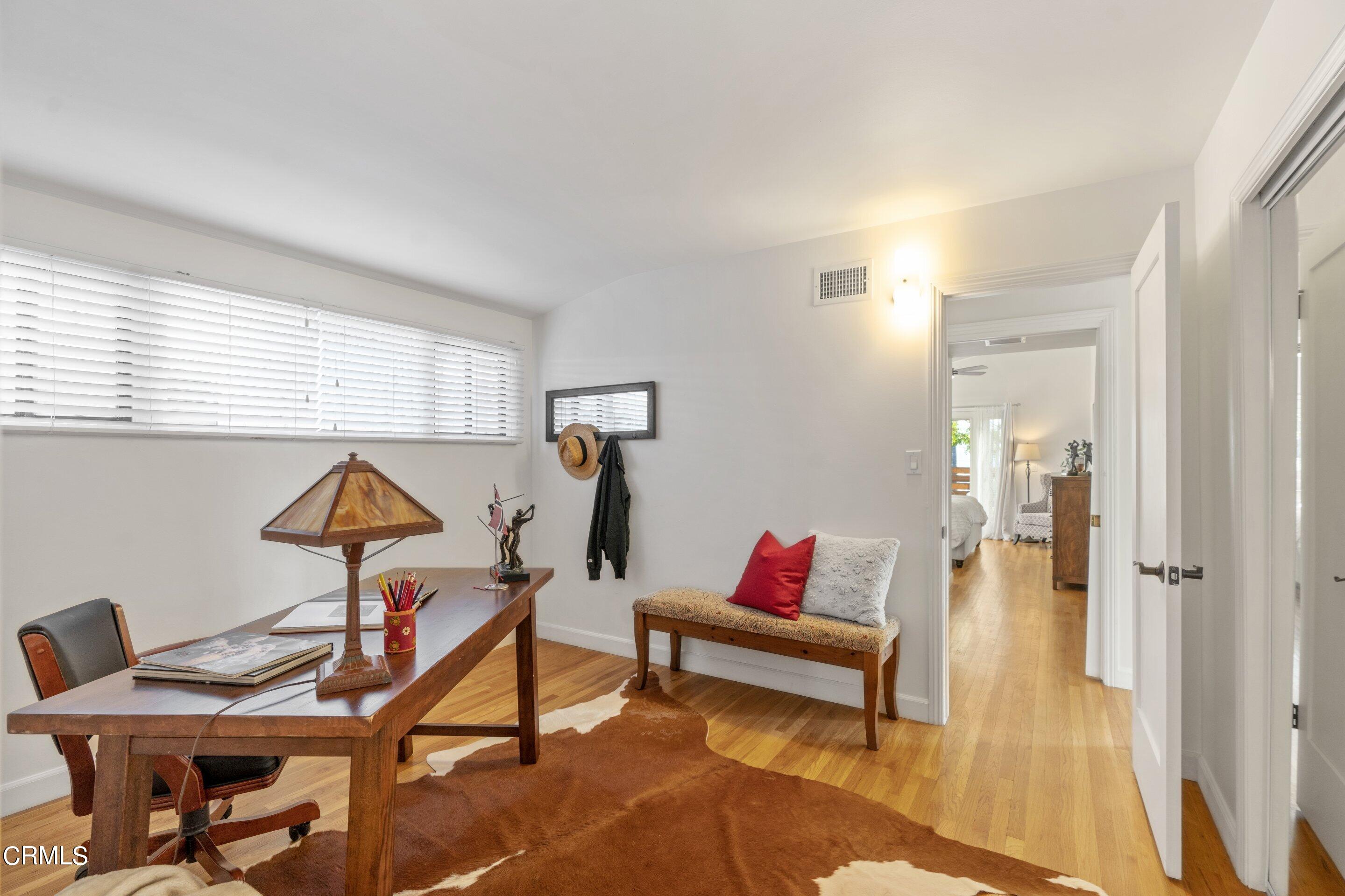 2664 Bogue Drive Glendale, CA 91208 - Photo 48 of 69 a living room with furniture a rug and a window