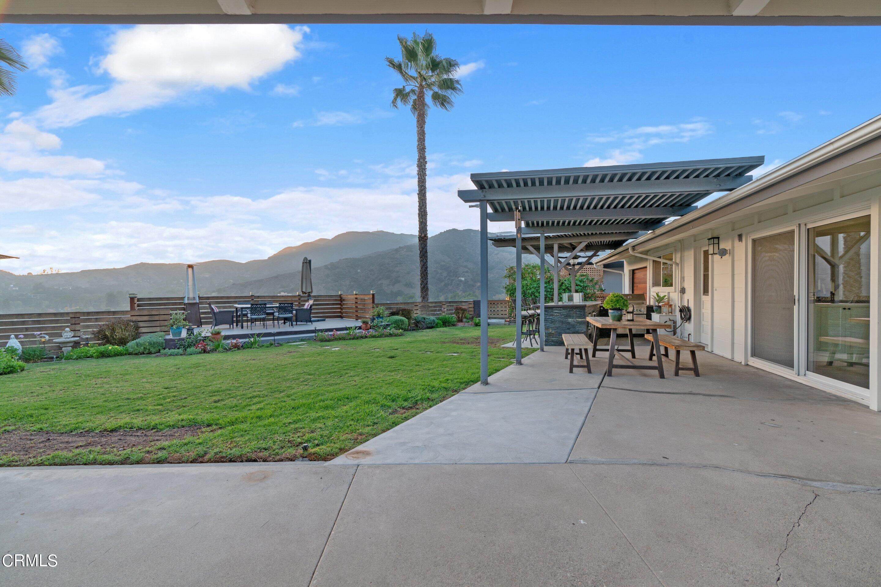 2664 Bogue Drive Glendale, CA 91208 - Photo 65 of 69 a patio with a table & chairs and a garden