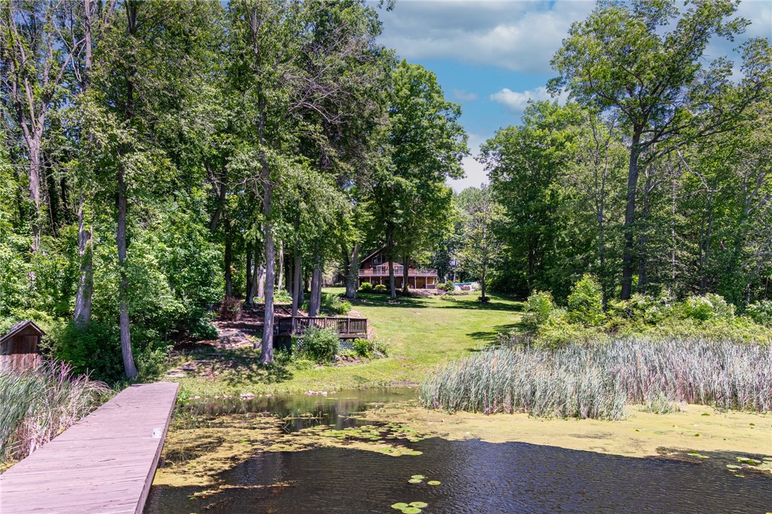 7733 East Port Bay Road Wolcott, NY 14590 - Photo 45 of 49 The view of the home from the 17 ft dock with a 30ft T extension