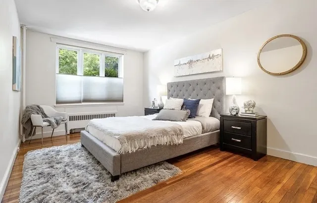 a bedroom with a bed and window