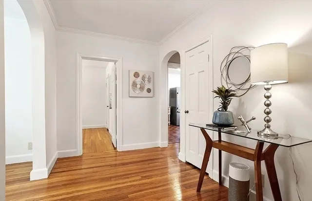a view of a livingroom with furniture and wooden floor