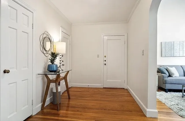 a view of a livingroom with furniture and wooden floor