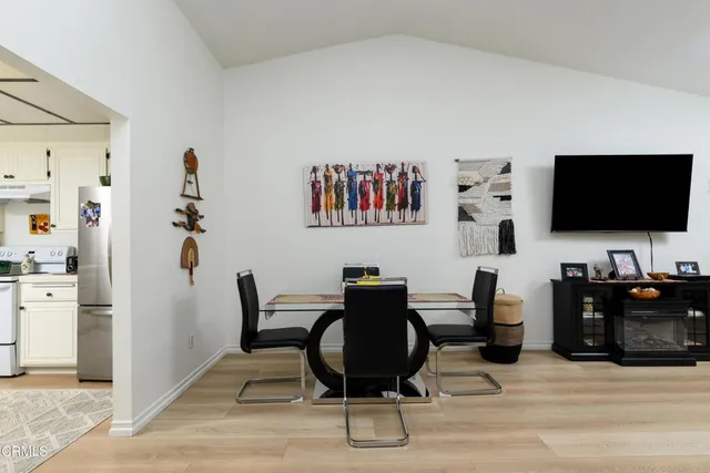 a view of a livingroom with furniture and a flat screen tv