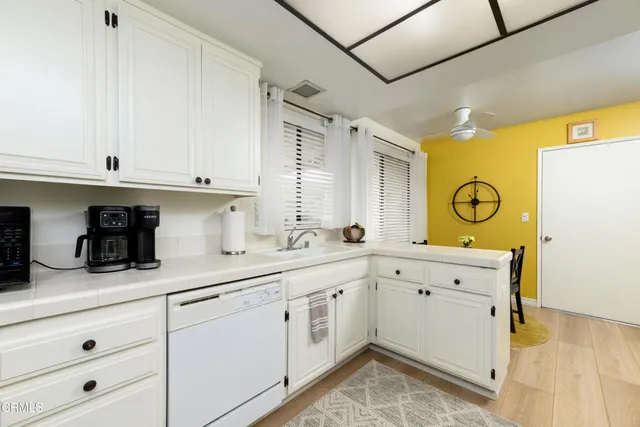 a view of cabinets and wooden floor