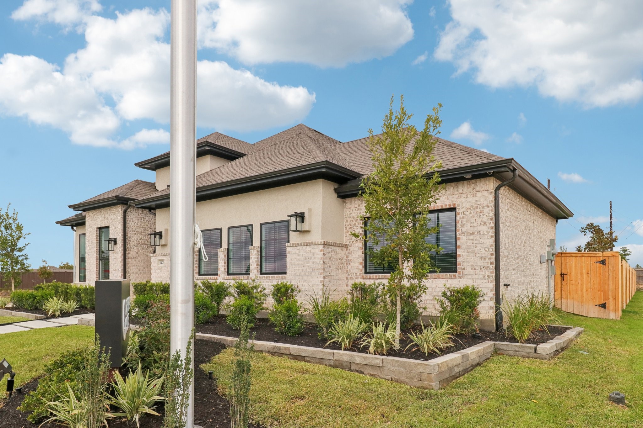 111 Rosa Peace Terrace Willis, TX 77318 - Photo 3 of 47 a view of house with small yard and potted plants