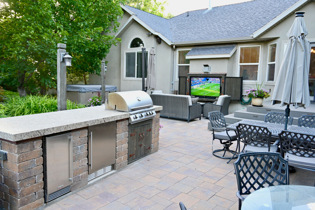 314 Brown Farm Lane Draper, UT 84020 - Photo 38 of 57 Expansive paver patio featuring a built-in outdoor kitchen with grill and stainless steel appliances