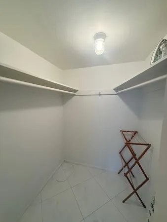 a view of a room with racks on the wall