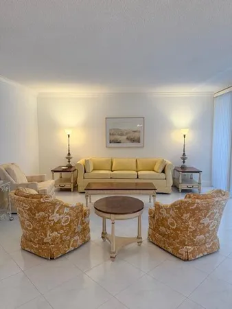 a living room with couch and a lamp
