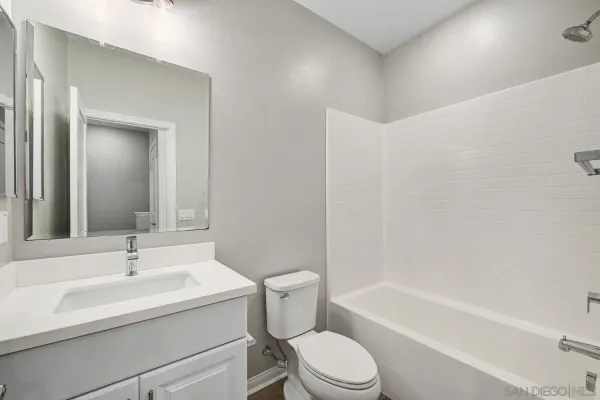 a bathroom with a sink toilet and a bathtub