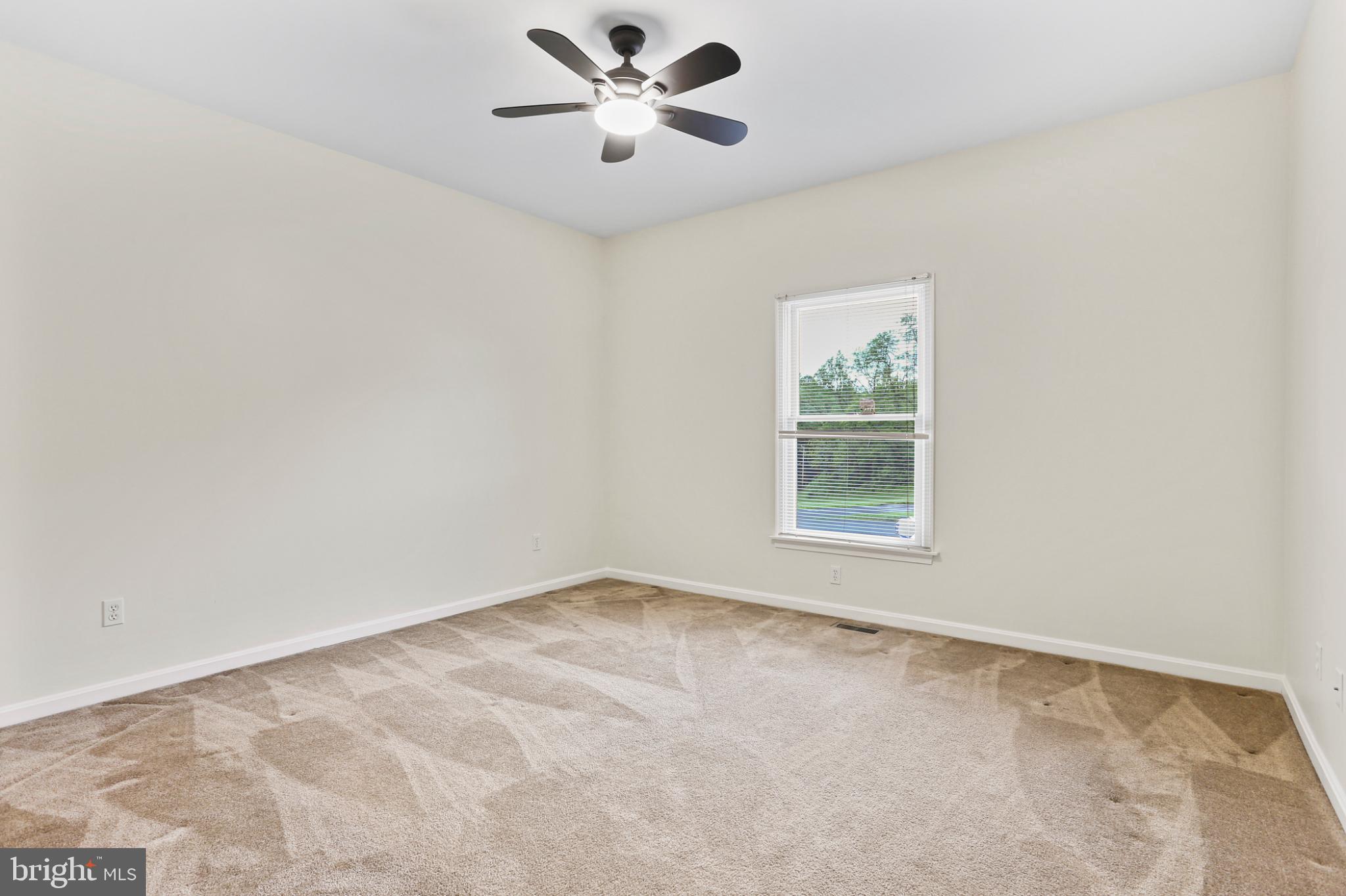 3547 Green Spring Road Havre de Grace, MD 21078 - Photo 11 of 50 an empty room with windows and fan