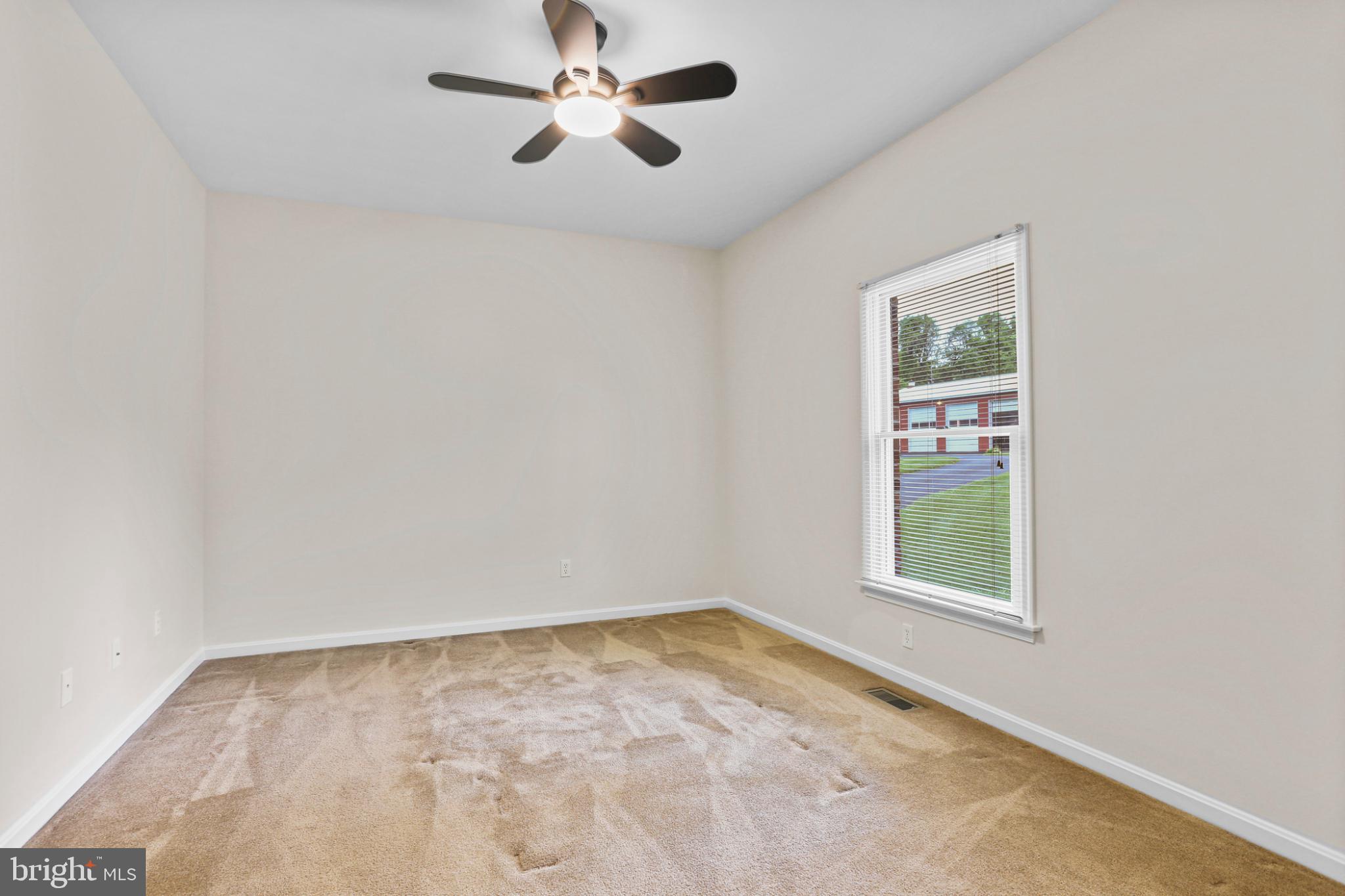 3547 Green Spring Road Havre de Grace, MD 21078 - Photo 13 of 50 an empty room with a window and a fan