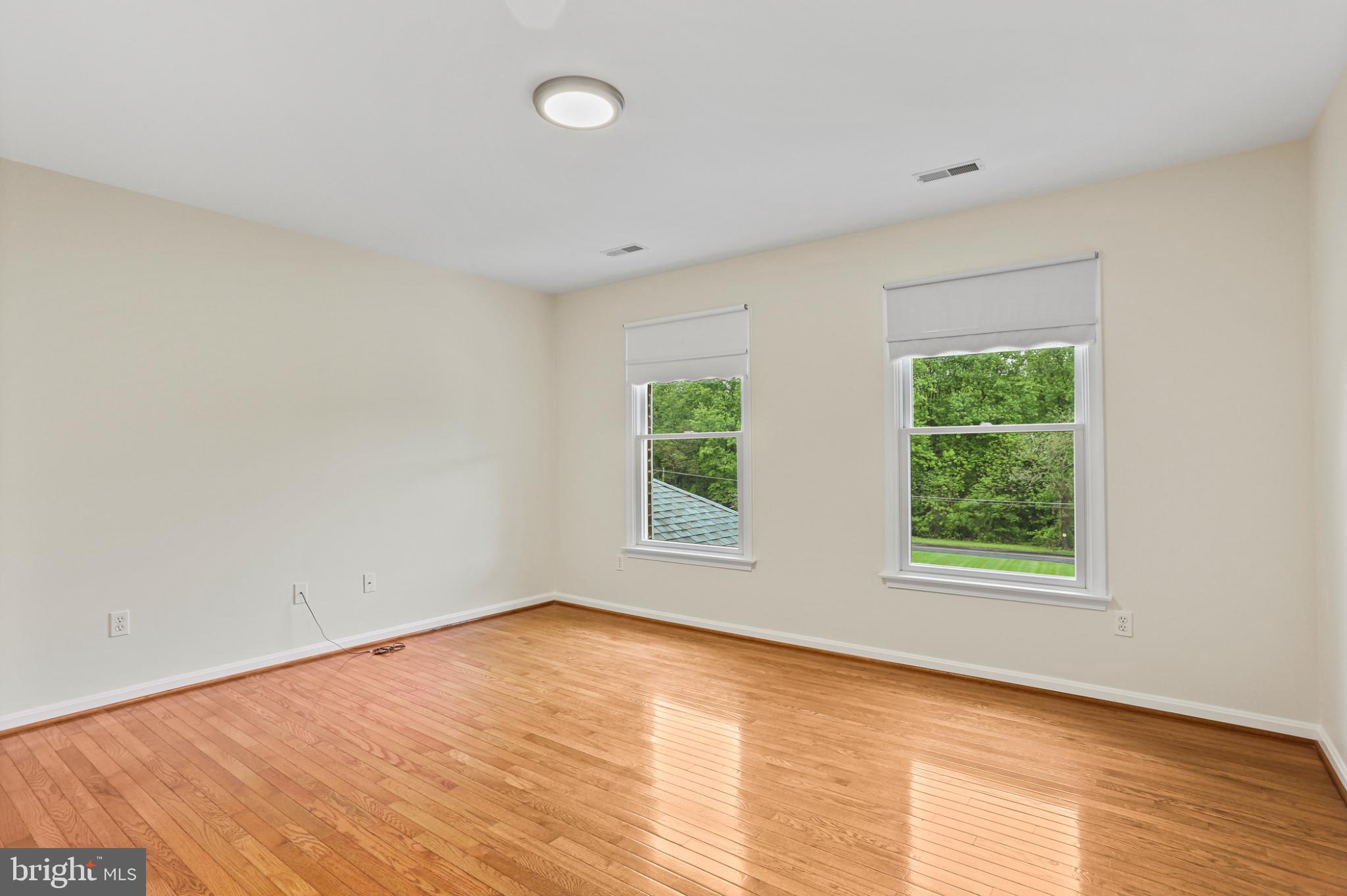 3547 Green Spring Road Havre de Grace, MD 21078 - Photo 18 of 50 an empty room with wooden floor and windows