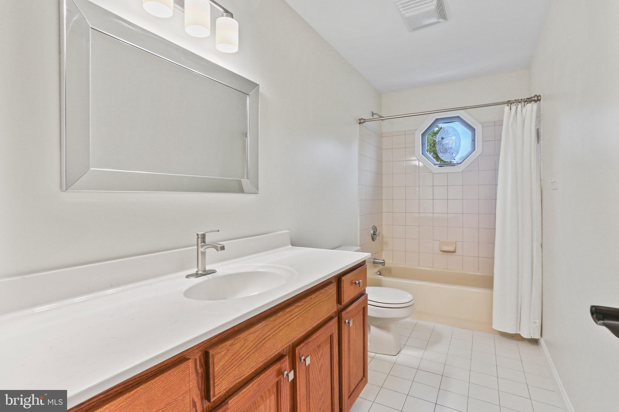 3547 Green Spring Road Havre de Grace, MD 21078 - Photo 20 of 50 a bathroom with a sink a toilet and a bathtub