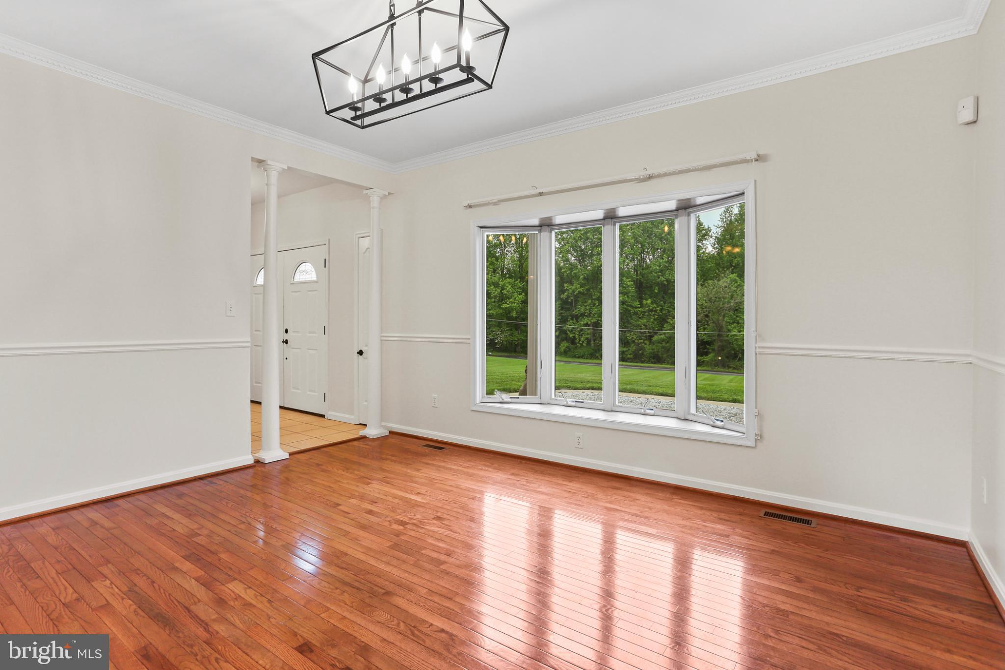 3547 Green Spring Road Havre de Grace, MD 21078 - Photo 4 of 50 a view of an empty room with wooden floor and a window