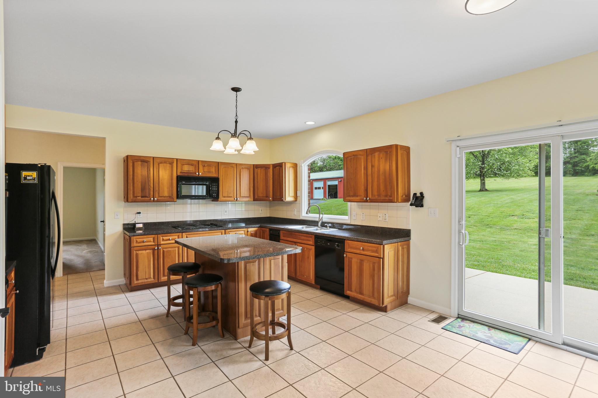 3547 Green Spring Road Havre de Grace, MD 21078 - Photo 5 of 50 a kitchen with stainless steel appliances granite countertop a stove top oven a sink dishwasher and a refrigerator with cabinets