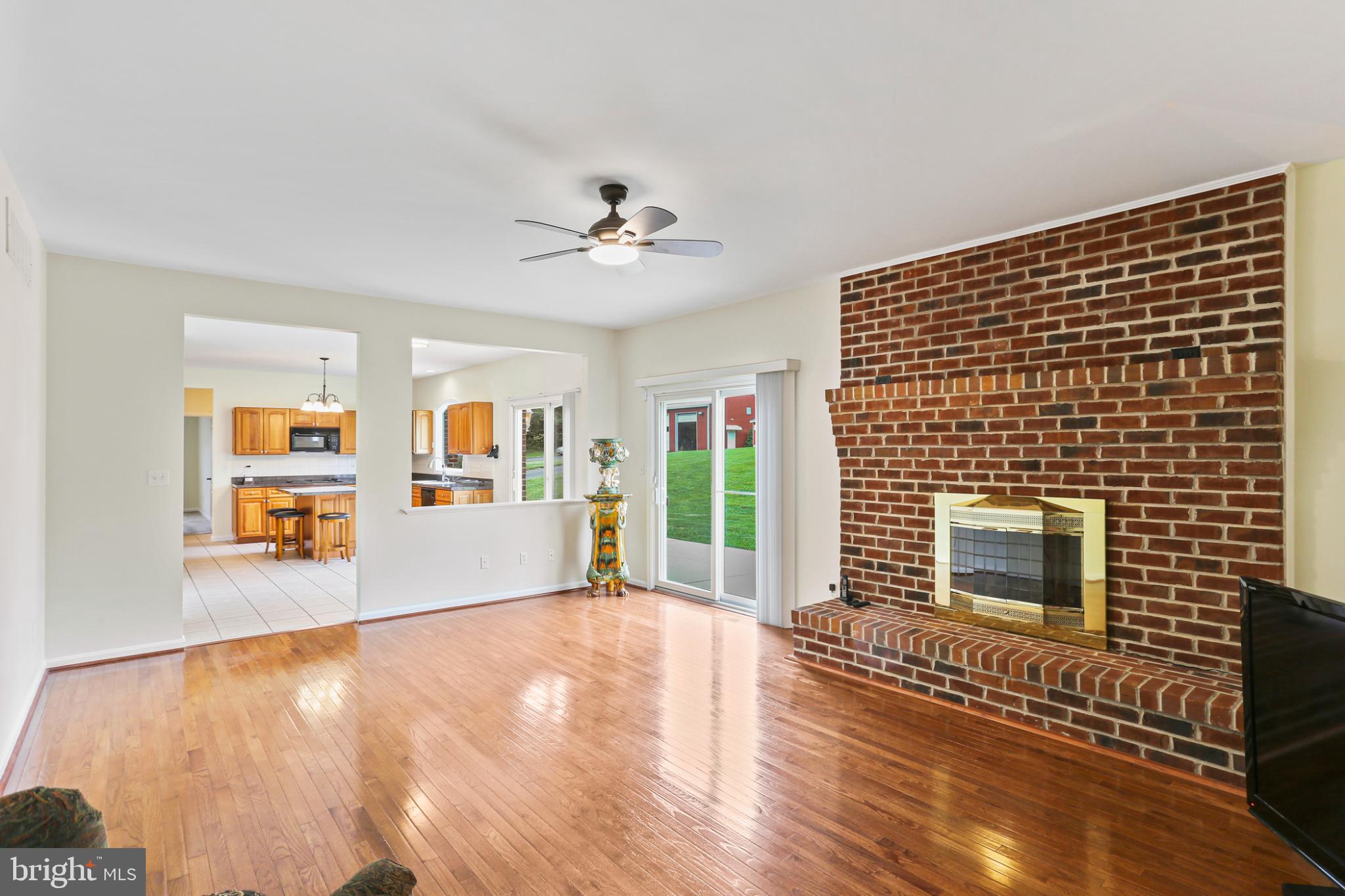 3547 Green Spring Road Havre de Grace, MD 21078 - Photo 10 of 50 a living room with stainless steel appliances wooden floor and chandelier