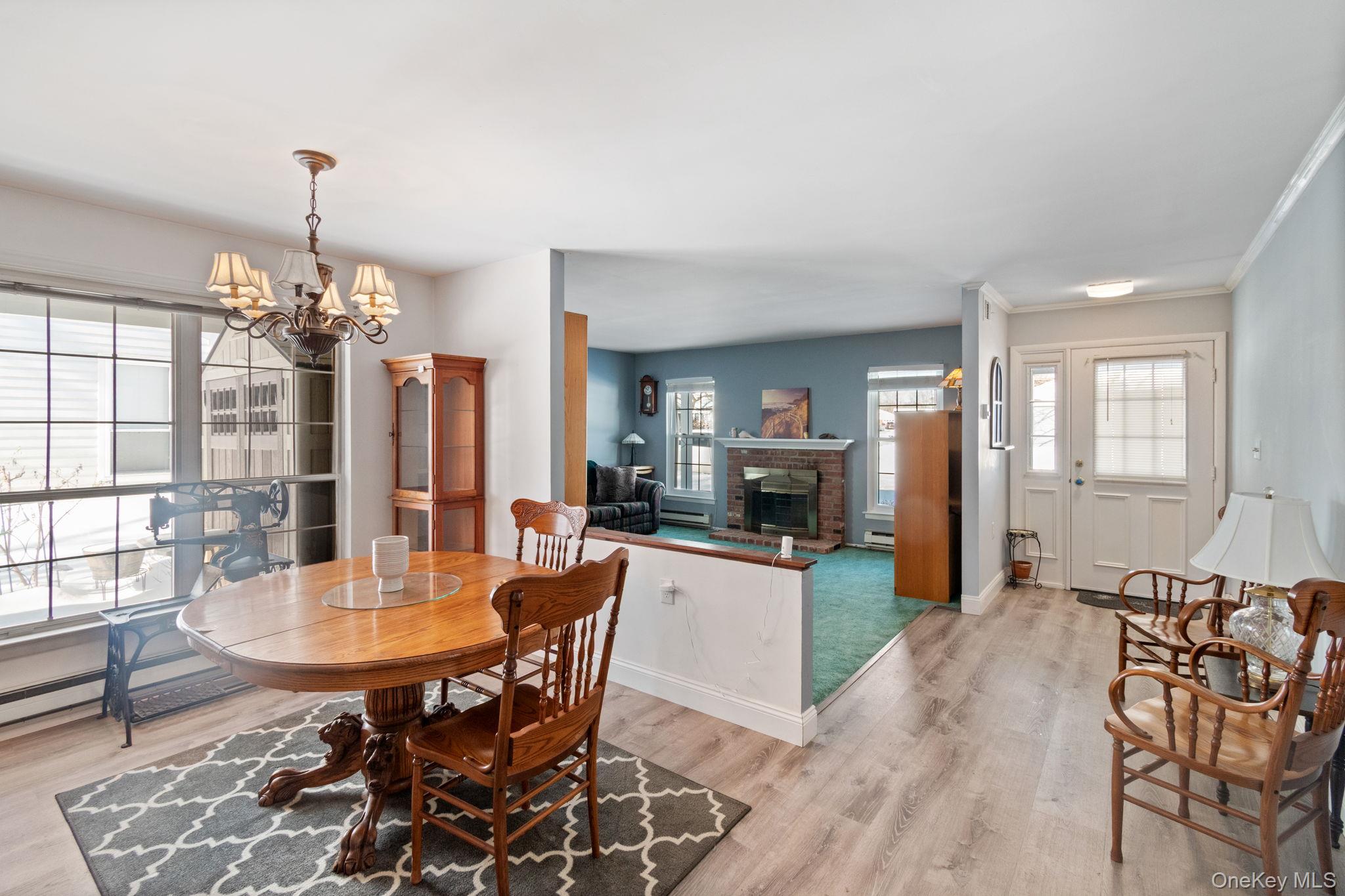 475 Stratford Lane Ridge, NY 11961 - Photo 6 of 16 a view of a dining room with furniture and window
