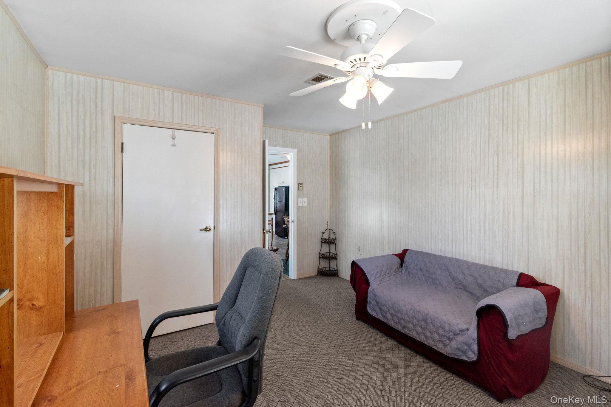 475 Stratford Lane Ridge, NY 11961 - Photo 10 of 16 a living room with furniture
